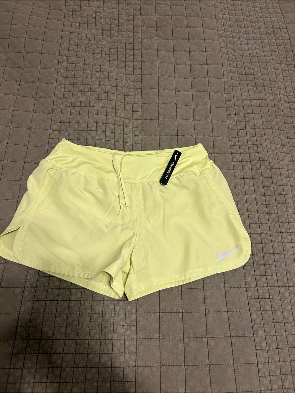 Nike Women's Light Yellow Athletic Shorts with Swoosh
